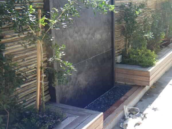 Prefab corten cladded wetwall - CBD